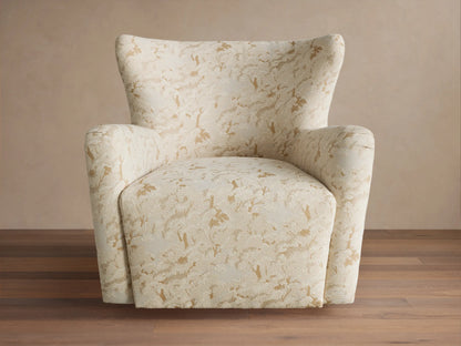 Sasha Swivel Chair, cream with gold abstract pattern, high back, rounded arms, angled left on wood floor.