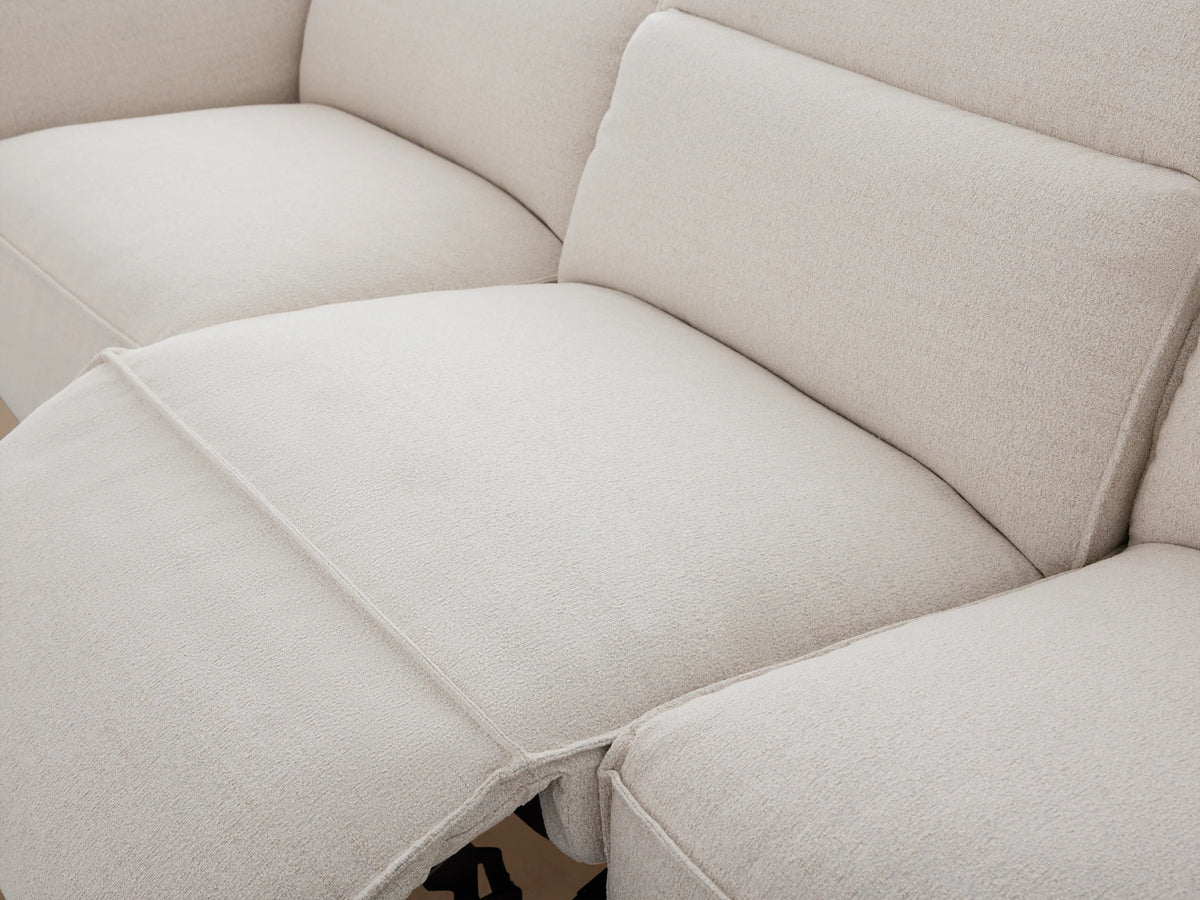 Light grey Coburn Five-Piece Motion Corner Sectional, L-shaped, against a neutral wall on a wood floor.