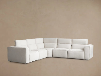Coburn Five-Piece Motion Corner Sectional in light neutral fabric, viewed from the back left, against a plain beige background.
