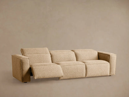 Coburn Three-Piece Motion Sofa, light beige textured fabric, seen from the back-right with three sections.