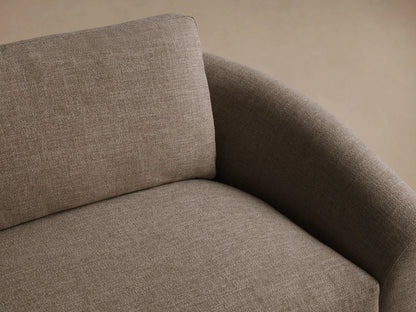 Avon Sofa in taupe woven fabric, featuring low, subtly curved arms, plush back/seat cushions, on a wood floor.
