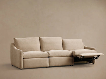 Front view of beige Kipton Slope Arm Three-Piece Motion Modular Sofa with the right-most recliner extended.
