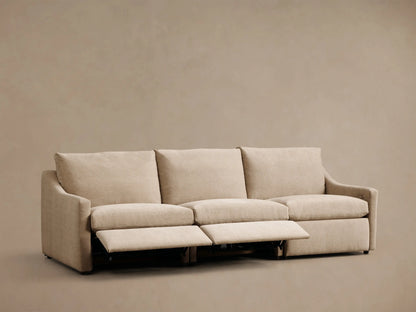 Front view of the beige Kipton Slope Arm Three-Piece Motion Modular Sofa with two footrests extended.