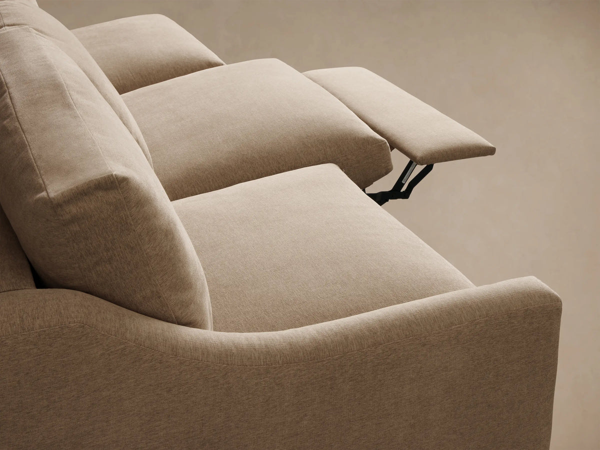 Front view of the beige Kipton Slope Arm Three-Piece Motion Modular Sofa with three cushions and three motion bases.