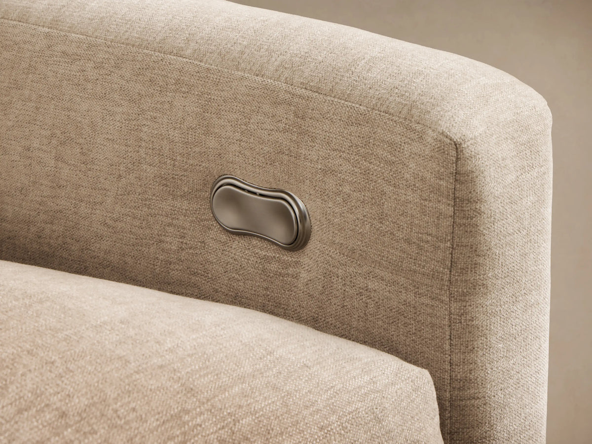 Close-up of the light beige Kipton Slope Arm Three-Piece Motion Modular Sofa with an extended footrest on one section.