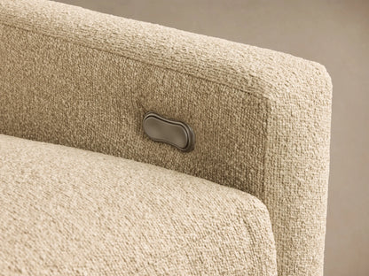 Close-up of light beige textured fabric on the Kipton Slope Arm Three-Piece Motion Modular Sofa, showing a silver recliner control button.