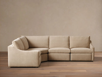 Front view of the beige Kipton Slope Arm Four-Piece Motion Sectional, arranged in an L-shape with a sloped left arm.