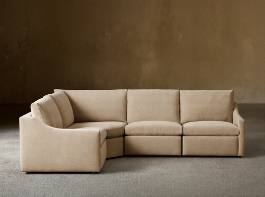 Front view of the beige Kipton Slope Arm Four-Piece Motion Sectional, arranged in an L-shape with a sloped left arm.