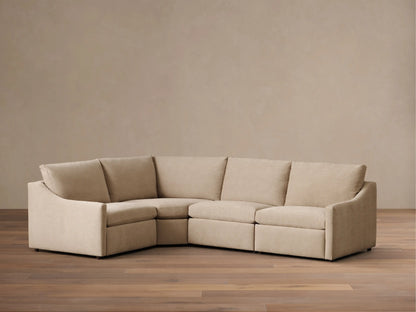 Front view of the beige Kipton Slope Arm Four-Piece Motion Sectional, arranged in an L-shape with a sloped left arm.