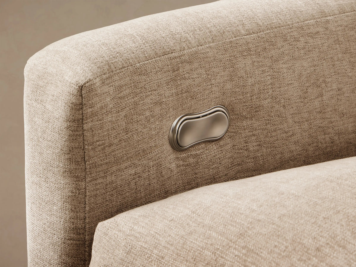 Front view of the beige Kipton Slope Arm Four-Piece Motion Sectional, an L-shaped sofa with sloping arms.