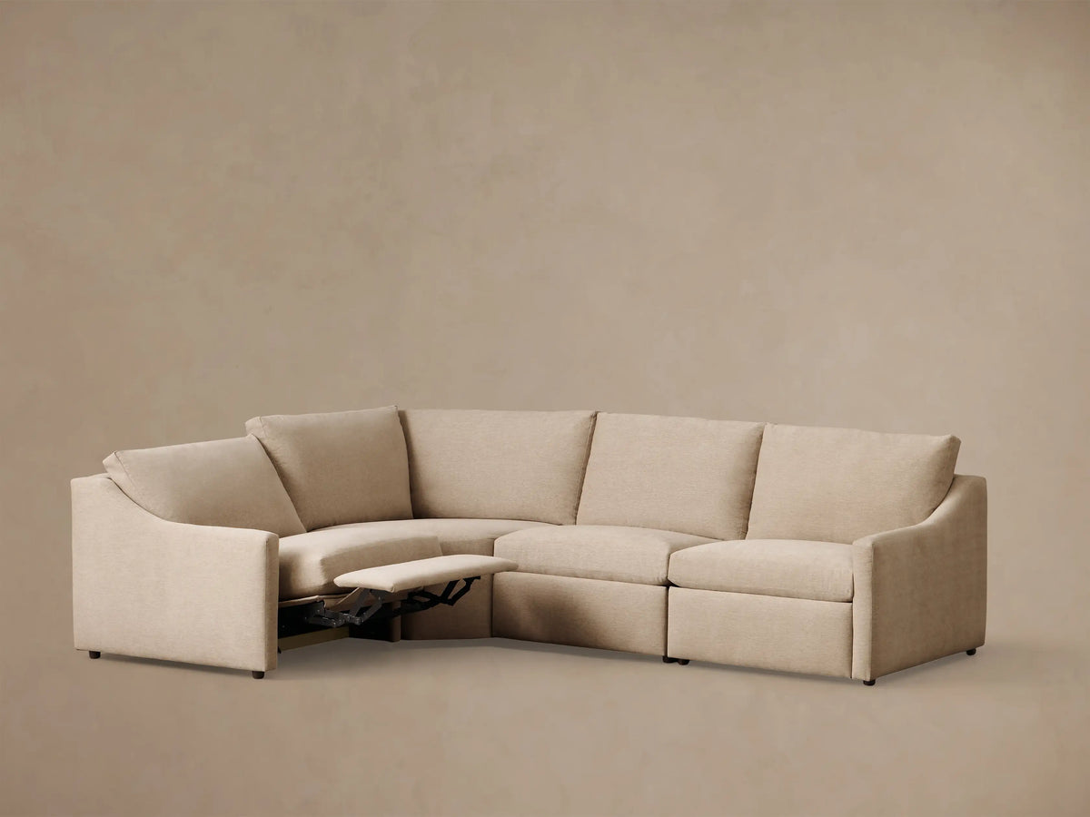 Rear view of the light beige Kipton Slope Arm Four-Piece Motion Sectional, showing its four modular pieces.