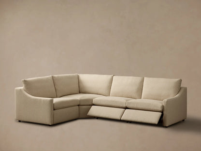 Rear view of the light beige Kipton Slope Arm Four-Piece Motion Sectional, highlighting its textured fabric and modular design.