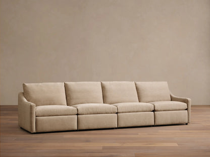 Front view of a beige Kipton Slope Arm Four-Piece Motion Modular Sofa with four seat cushions and sloped arms.