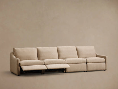 Front view of a beige Kipton Slope Arm Four-Piece Motion Modular Sofa with two footrests extended.