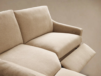 Front view of a light beige Kipton Slope Arm Four-Piece Motion Sectional, L-shaped with two seats extended for recline.