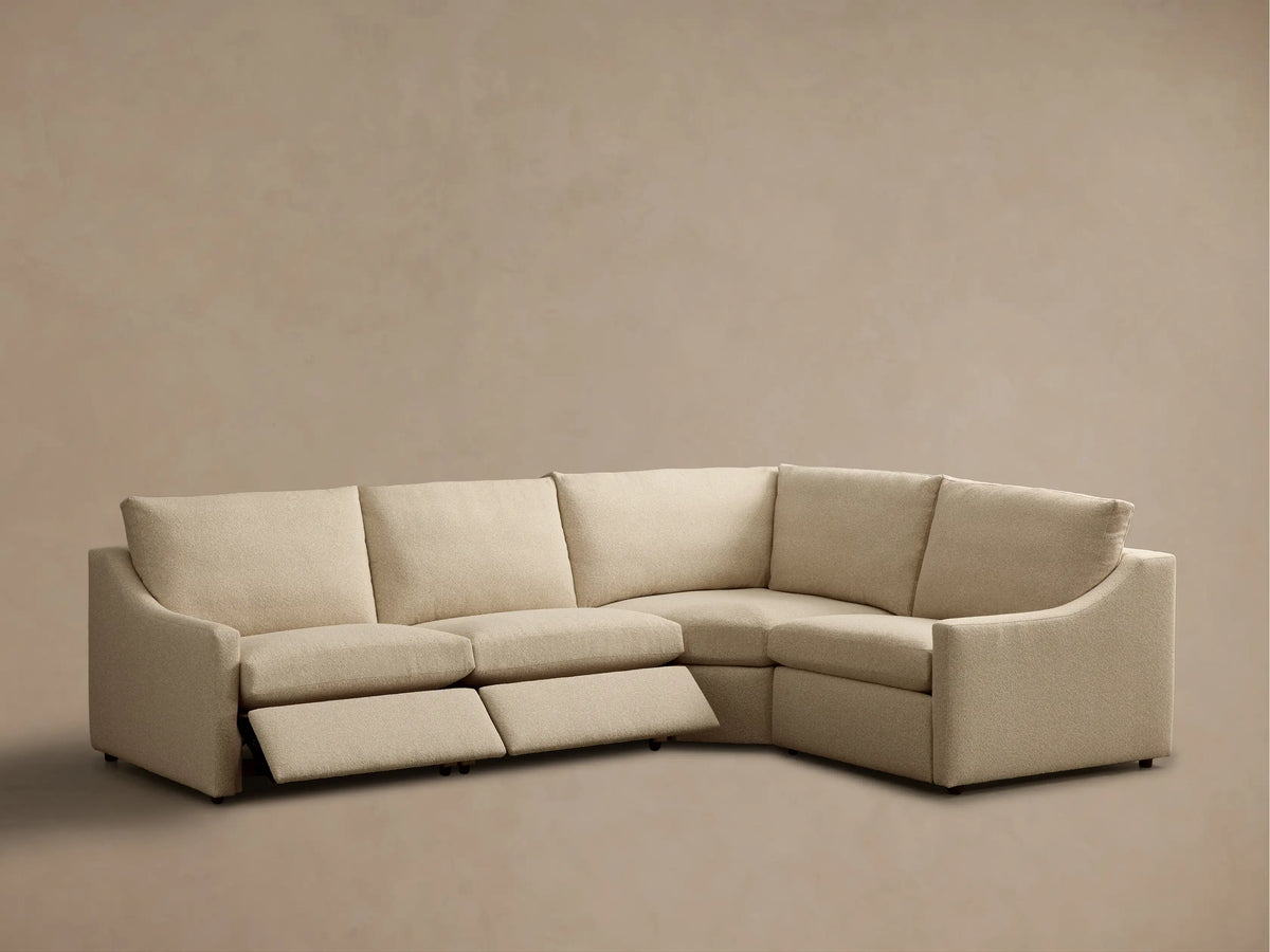 Rear view of the beige Kipton Slope Arm Four-Piece Motion Sectional, featuring its textured boucle fabric and four modular sections.