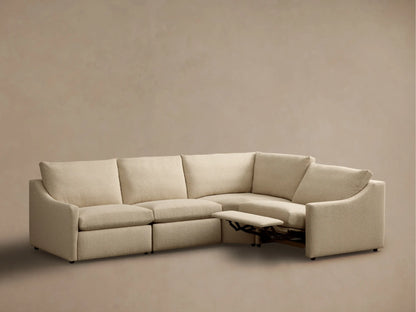 Front view of light beige Kipton Slope Arm Four-Piece Motion Sectional with two extended footrests.