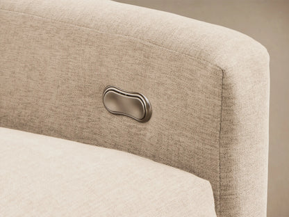 Angled view of a light beige Kipton Slope Arm Five-Piece Motion Corner Sectional with one footrest extended.