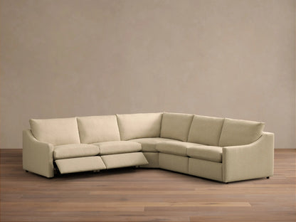 Front view of a Beige Kipton Slope Arm Five-Piece Motion Corner Sectional, showing its L-shape and textured fabric.
