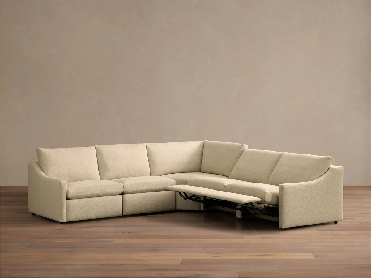 Rear view of the cream Kipton Slope Arm Five-Piece Motion Corner Sectional, showing its connected modular sections.