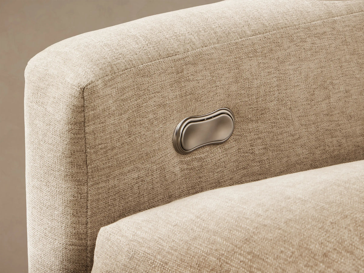 Front view of the light beige Kipton Slope Arm Six-Piece Motion Sectional arranged in an L-shape.