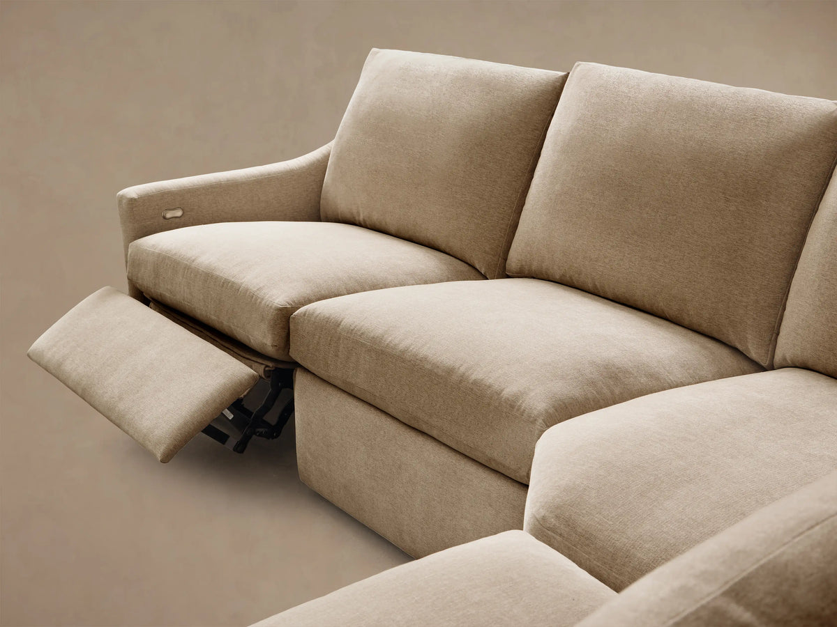 Close-up of the beige woven fabric and silver two-button motion control on the Kipton Slope Arm Six-Piece Motion Sectional.