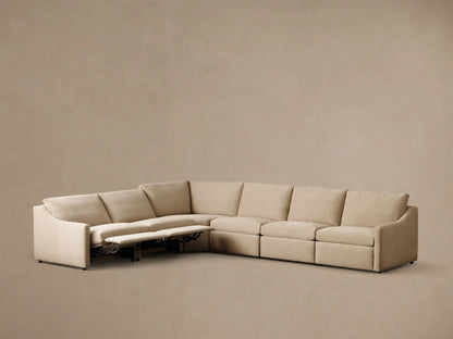 Angled front view of a beige Kipton Slope Arm Six-Piece Motion Sectional with two extended footrests.