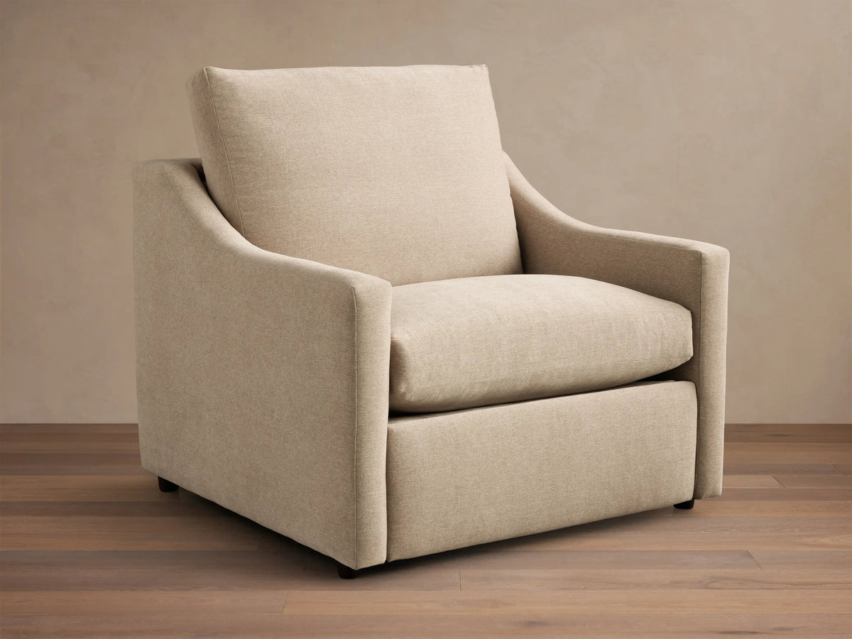 Front view of the light beige textured Kipton Slope Arm Motion Recliner with distinct slope arms and a rectangular back cushion.