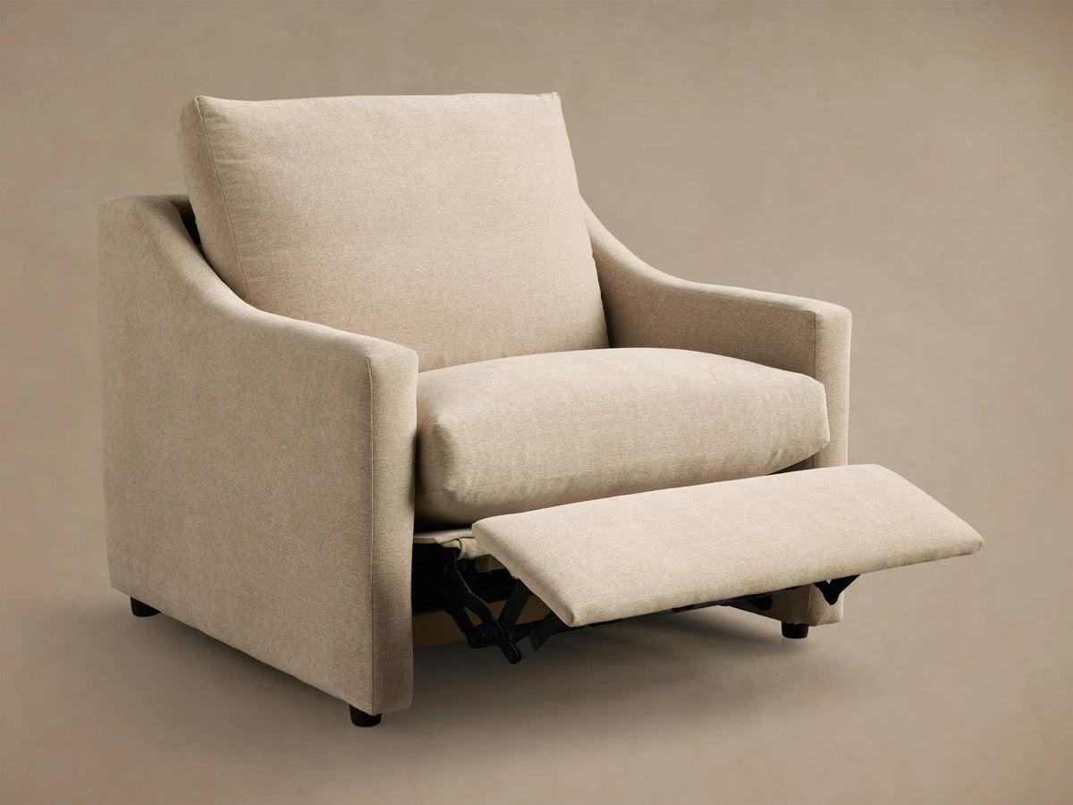 Rear view of a beige Kipton Slope Arm Motion Recliner, showing its upholstered back and sloped armrests.
