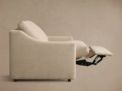 Light beige Kipton Slope Arm Motion Recliner with sloped arms, footrest extended, showing its reclining mechanism.
