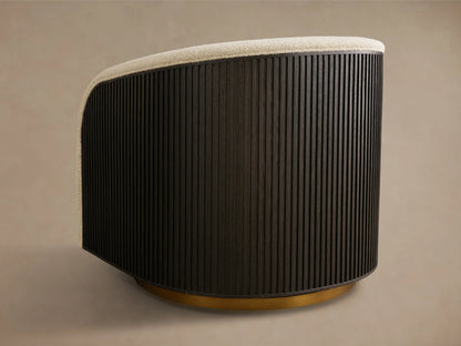 Side view of the Finnley Swivel Chair with a dark fluted wood back, light beige textured fabric rim, and brass swivel base.