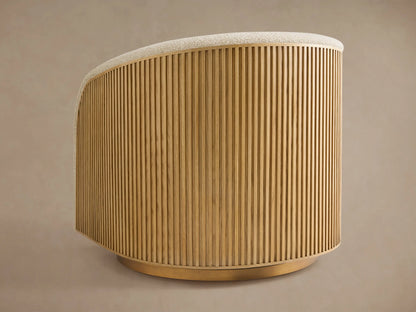 Side profile of the Finnley Swivel Chair, featuring Honey-finished slatted wood, a cream upholstered top, and a metallic gold base.