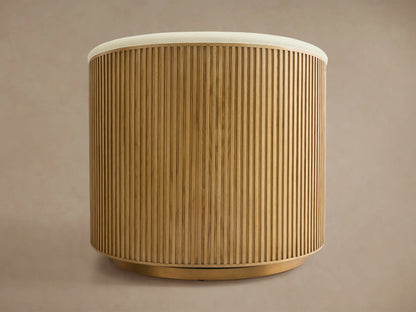 Finnley Swivel Chair with a curved back, featuring vertical wooden slats in a honey finish. Beige cushion edges peek at the top.
