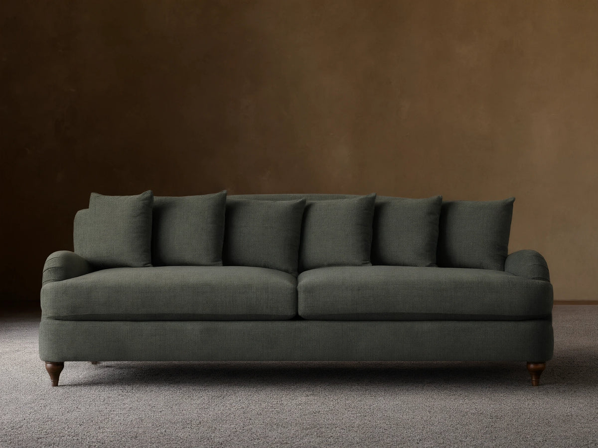 Hanover Sofa in deep greenish-grey textured fabric, with 3 seat & 5 back cushions, rolled arms, on wood floor.