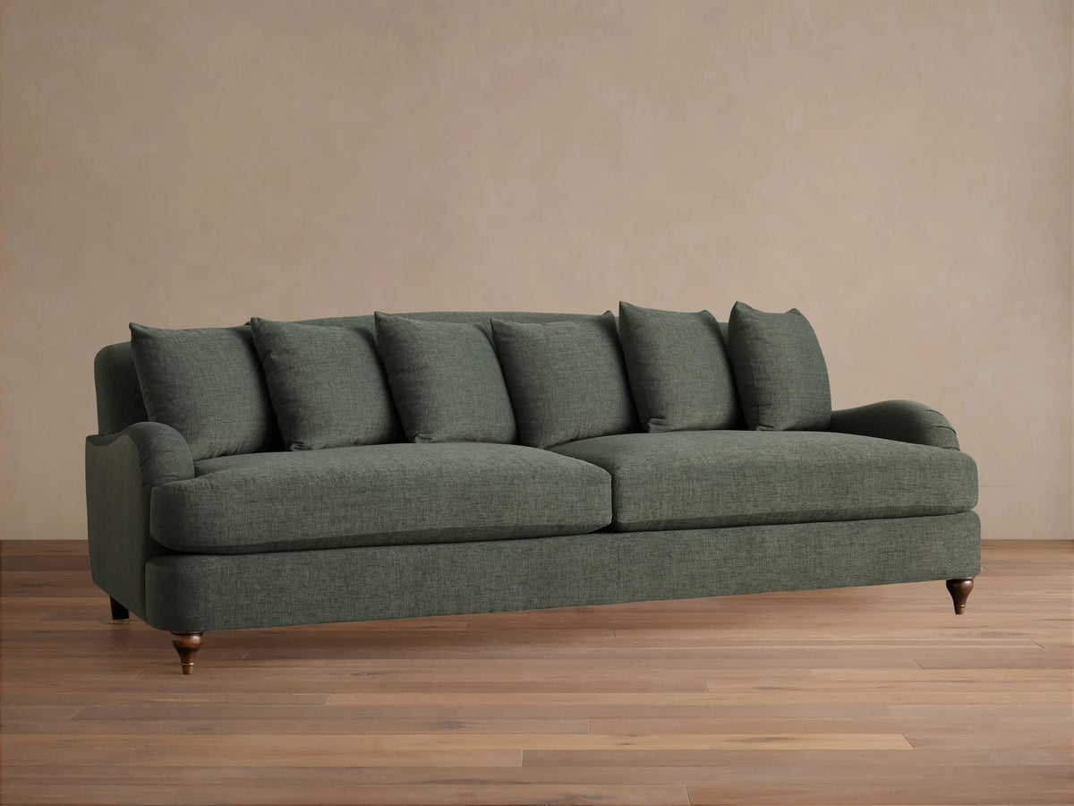 Front view of the dark gray Hanover Sofa, featuring deep seat cushions and plush back cushions, in a living room setting.
