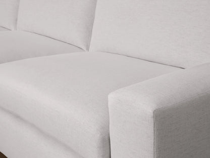 Kipton Wide Arm Two-Piece Chaise Sectional in light grey fabric, featuring a wide armrest and plush seat cushions, viewed from a side angle.