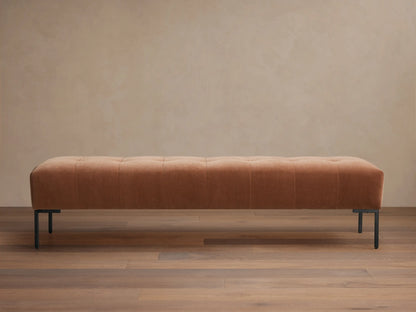 Tilton Tufted Bench, long muted terracotta tufted upholstered bench with minimalist black metal legs on wood floor.