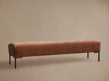 Tilton Tufted Bench, long muted terracotta tufted upholstered bench with minimalist black metal legs on wood floor.
