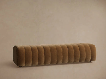 Close-up of Fresno Channel-Stitched Bench with plush, brown fabric and deep, parallel channel tufting, showing texture.