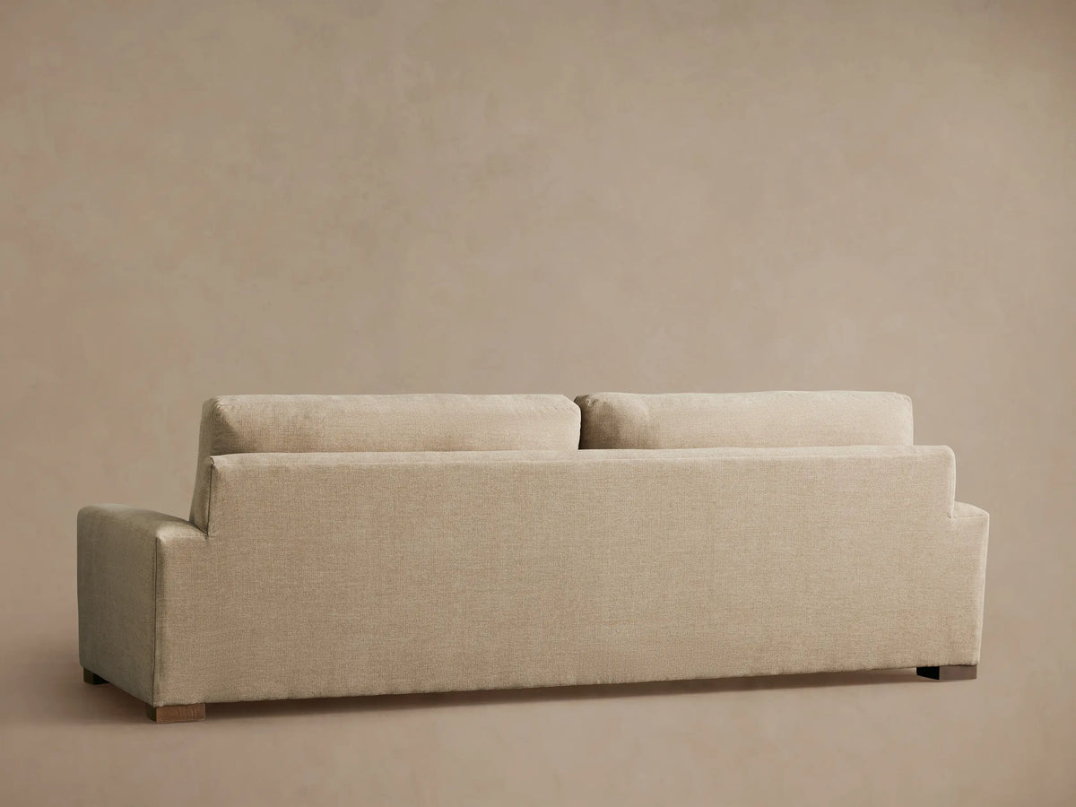 Beige Remington Sofa with a close-up view of the armrest, backrest, and seat cushion, showcasing its smooth fabric texture.