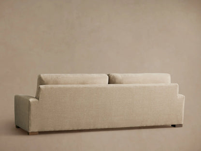 Beige Remington Sofa with a close-up view of the armrest, backrest, and seat cushion, showcasing its smooth fabric texture.
