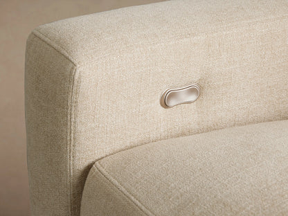 Remington Three-Piece Motion Sofa, cream-colored textured fabric, low arms, wooden legs, on a wooden floor.