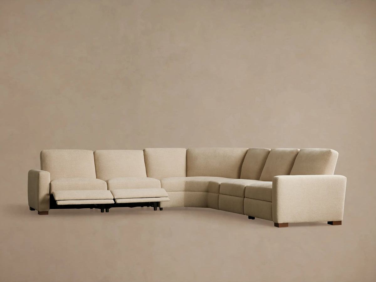 Rear view of a light beige Remington Five-Piece Motion Corner Sectional, showing five modular upholstered sections forming a corner.