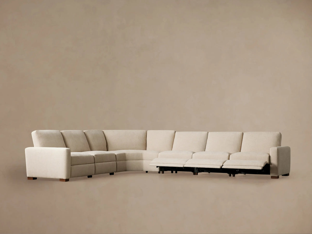 Remington Motion Sectional, close-up of a beige woven fabric seat with an extended footrest for reclining.