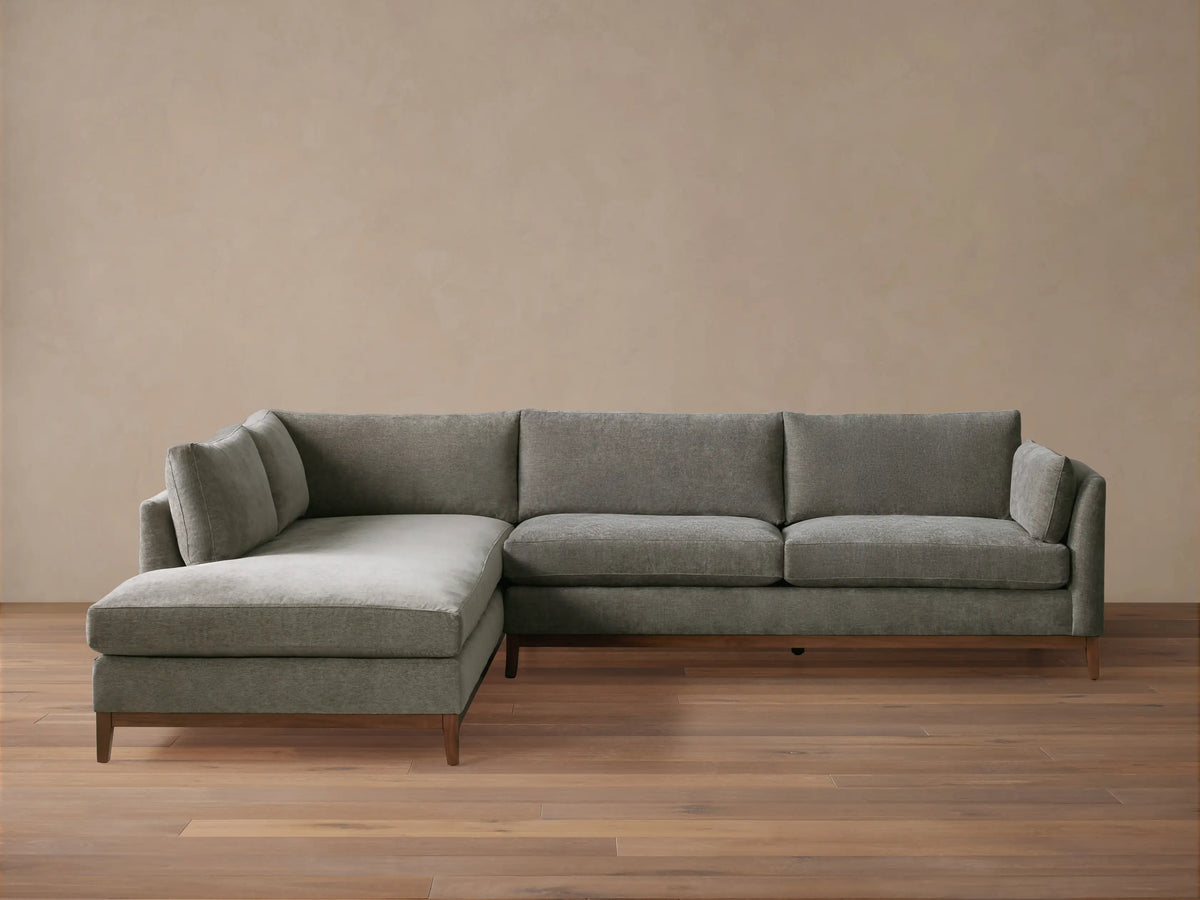 Bainbridge Two-Piece Bumper Sectional in L-shape, upholstered in gray fabric, with a left-facing chaise, on wood floor.