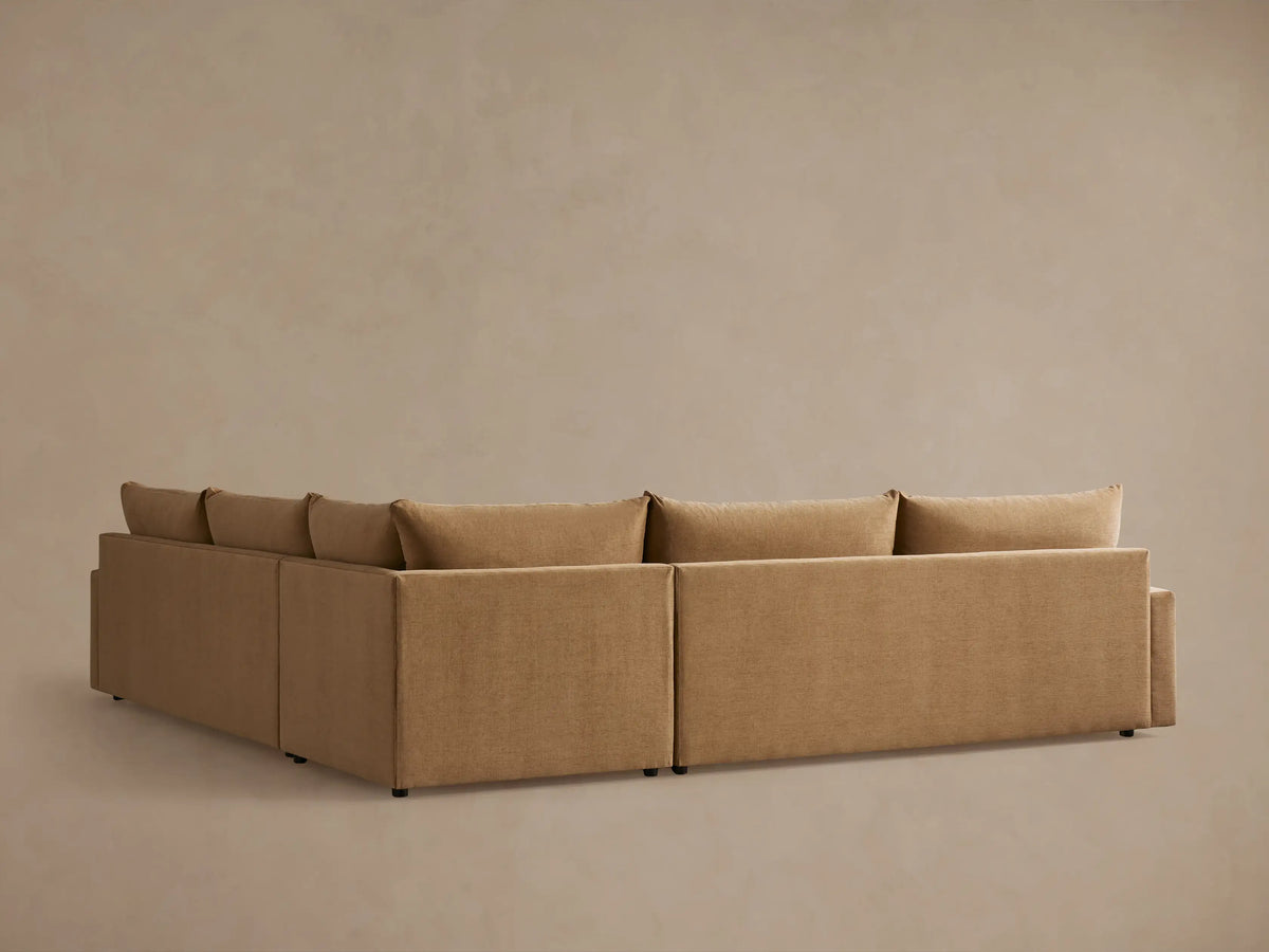 Calistoga Three-Piece Corner Sectional in beige fabric, featuring plush cushions and a smooth, minimalistic armrest design.