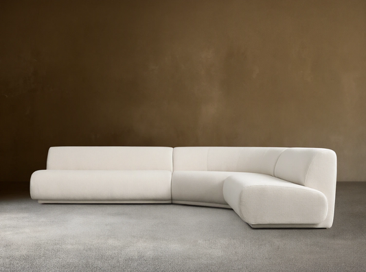 Gianni Three-Piece Corner Sectional in white fabric, featuring a modern, minimalist design. Set on a light wood floor against a beige wall.