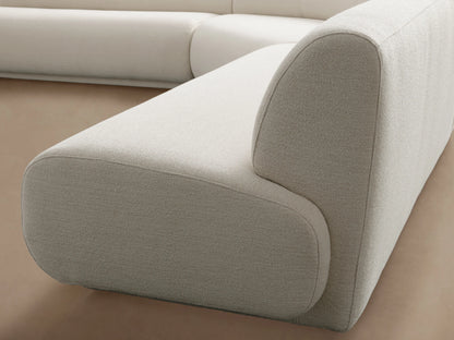 Gianni Three-Piece Corner Sectional in white with smooth cushions, showcasing a sleek design, placed on a wooden floor.