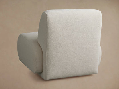 Gianni Swivel Chair in light beige fabric showing a close-up of the armrest and seat cushion with a textured surface.