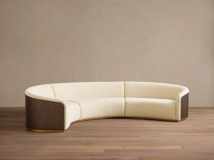 Front view of a Cream Finnley Three-Piece Curved Sectional, dark brown slatted wood side panels, and golden base.